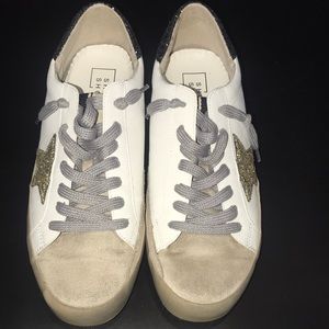 Barely worn Shu Shop shoe with a glittery gold star